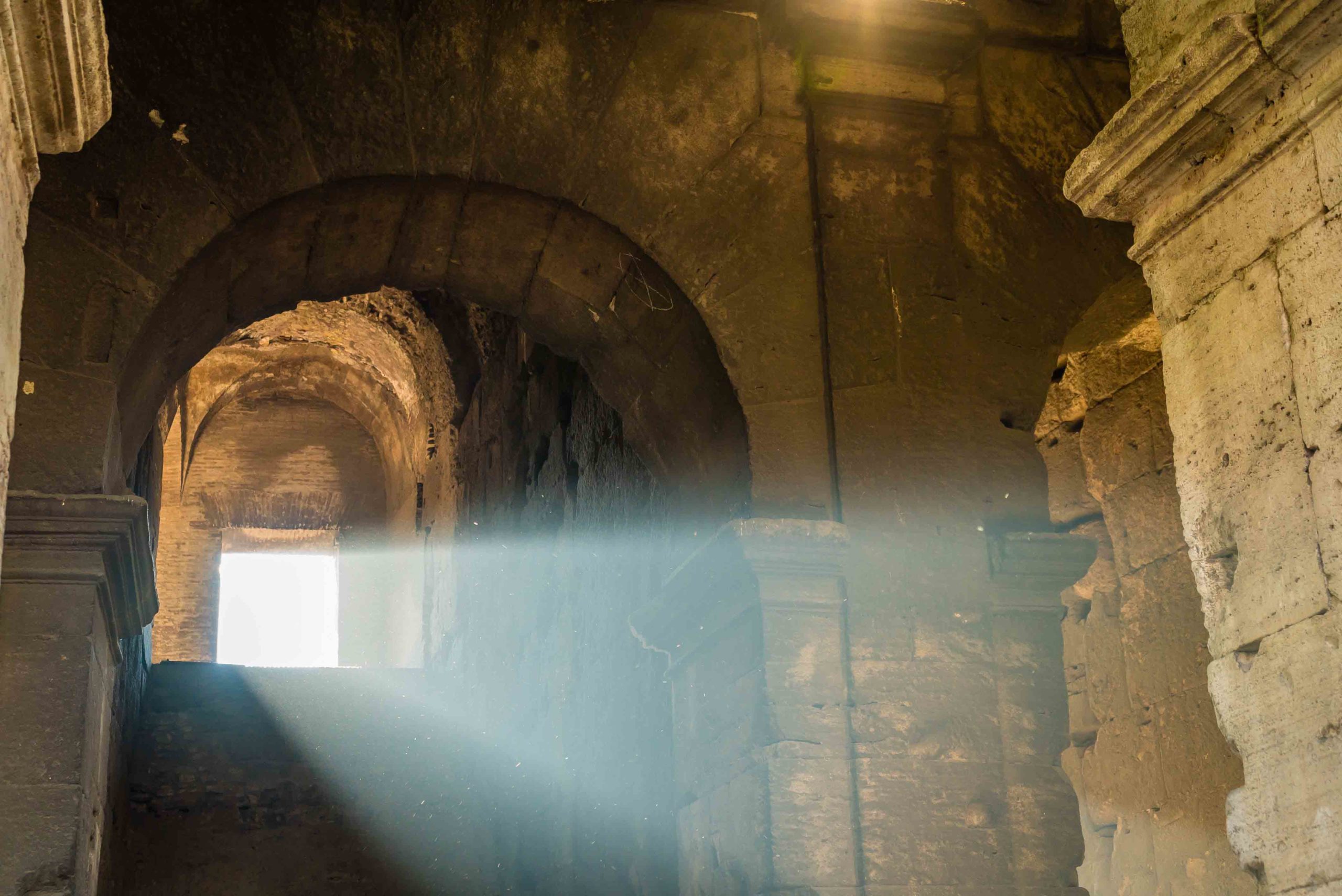 Sunlight coming from a window of the Colosseum in Rome